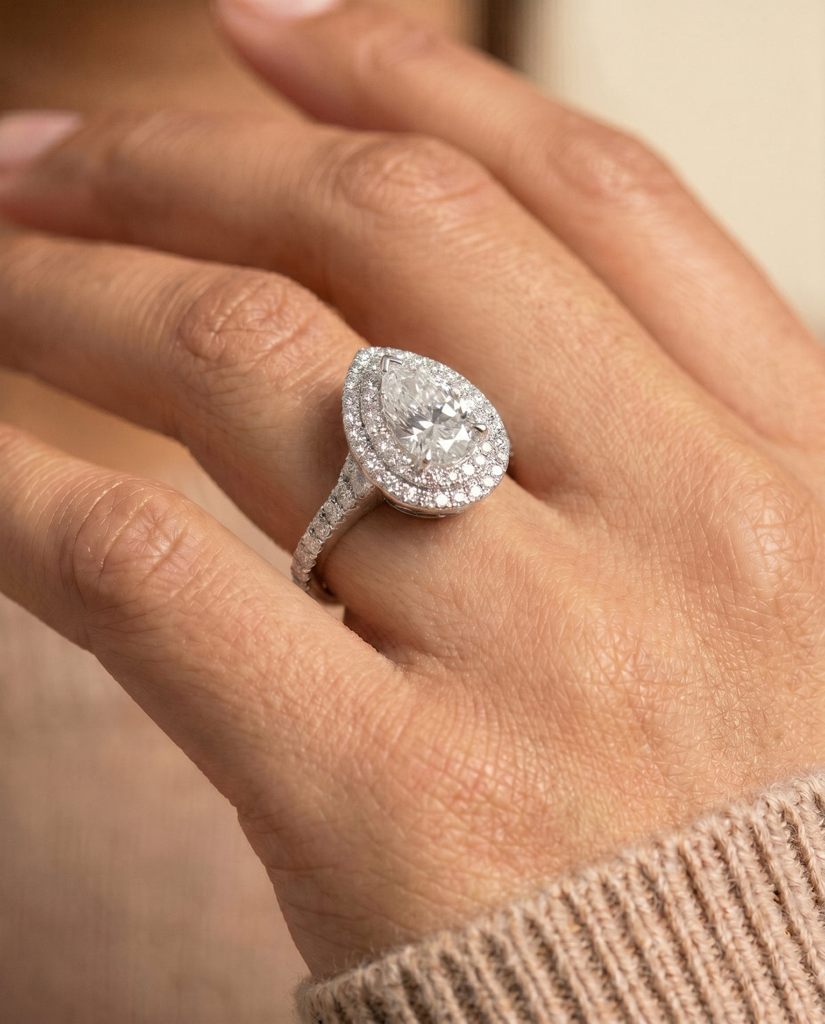 Britney Select Double Halo Pear Lab Diamond Engagement Ring in Platinum, shown on hand | RockHer
