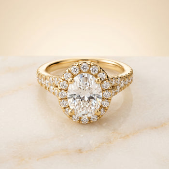 The Calliope Petite Split Shank Halo Oval Engagement Ring Setting in 18K Yellow Gold