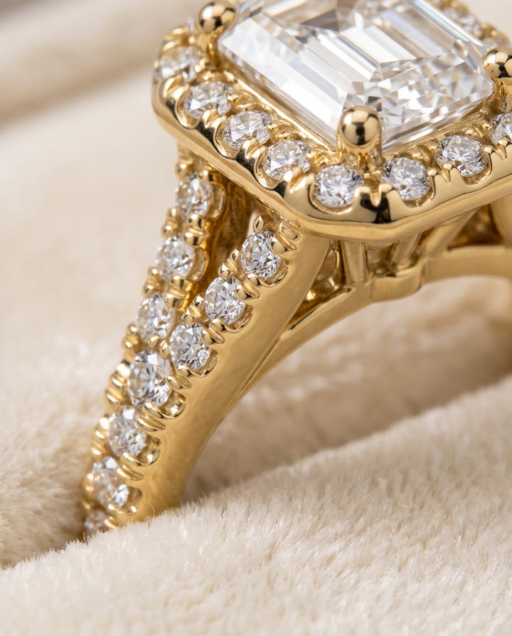 The Calliope Petite Split Shank Halo Emerald Cut Engagement Ring Setting in 18K Yellow Gold