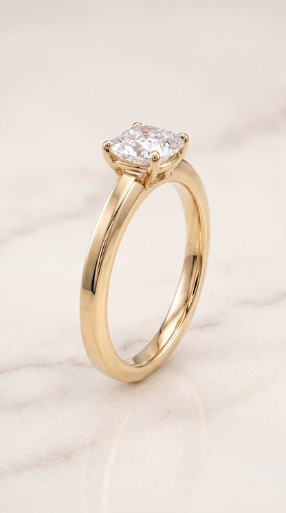 The Carmen Beveled Edge Comfort Fit Solitaire Cushion Cut Engagement Ring Setting in 18K Yellow Gold