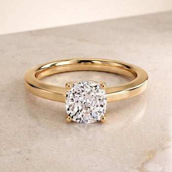 The Carmen Beveled Edge Comfort Fit Solitaire Cushion Cut Engagement Ring Setting in 18K Yellow Gold