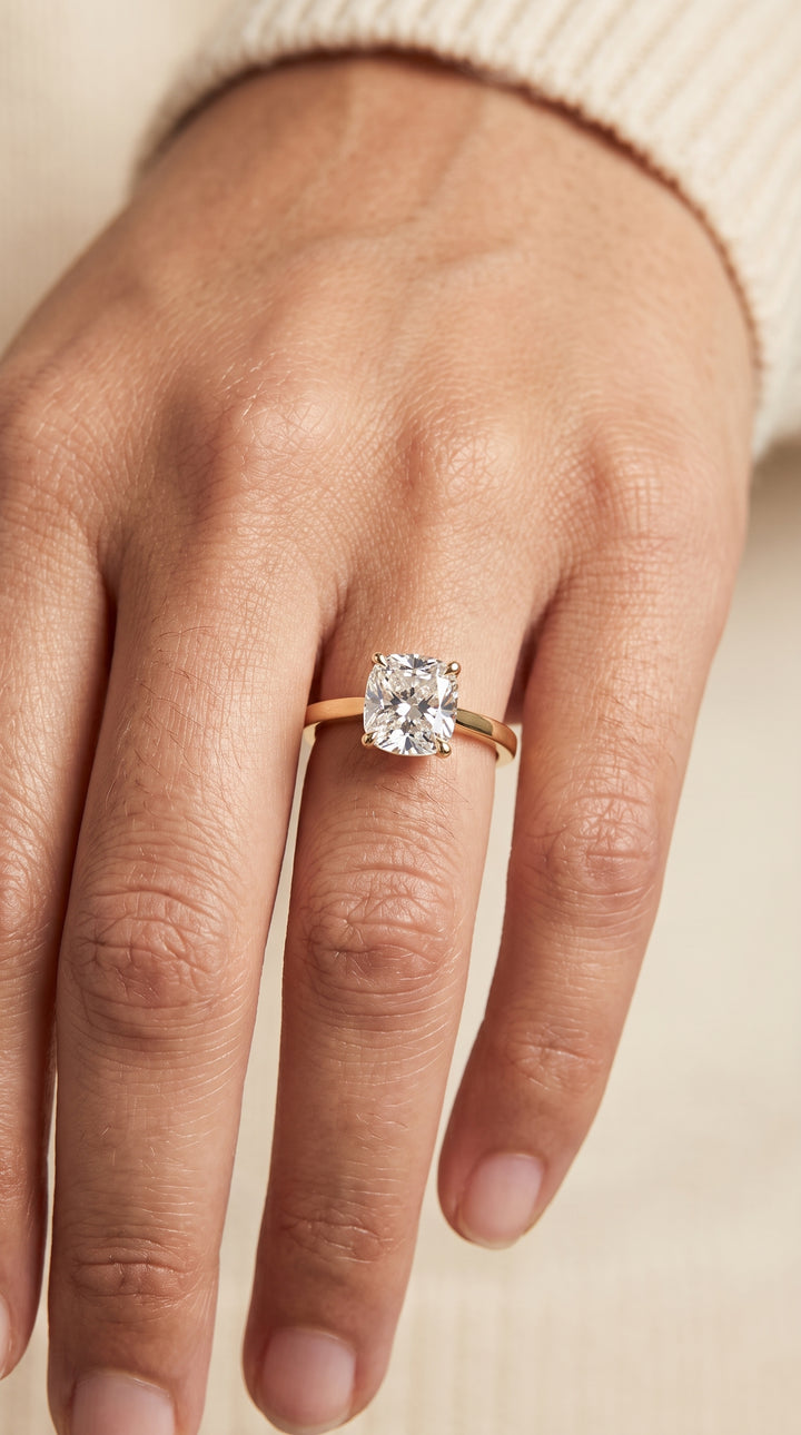 The Carmen Beveled Edge Comfort Fit Solitaire Cushion Cut Engagement Ring Setting in 18K Yellow Gold