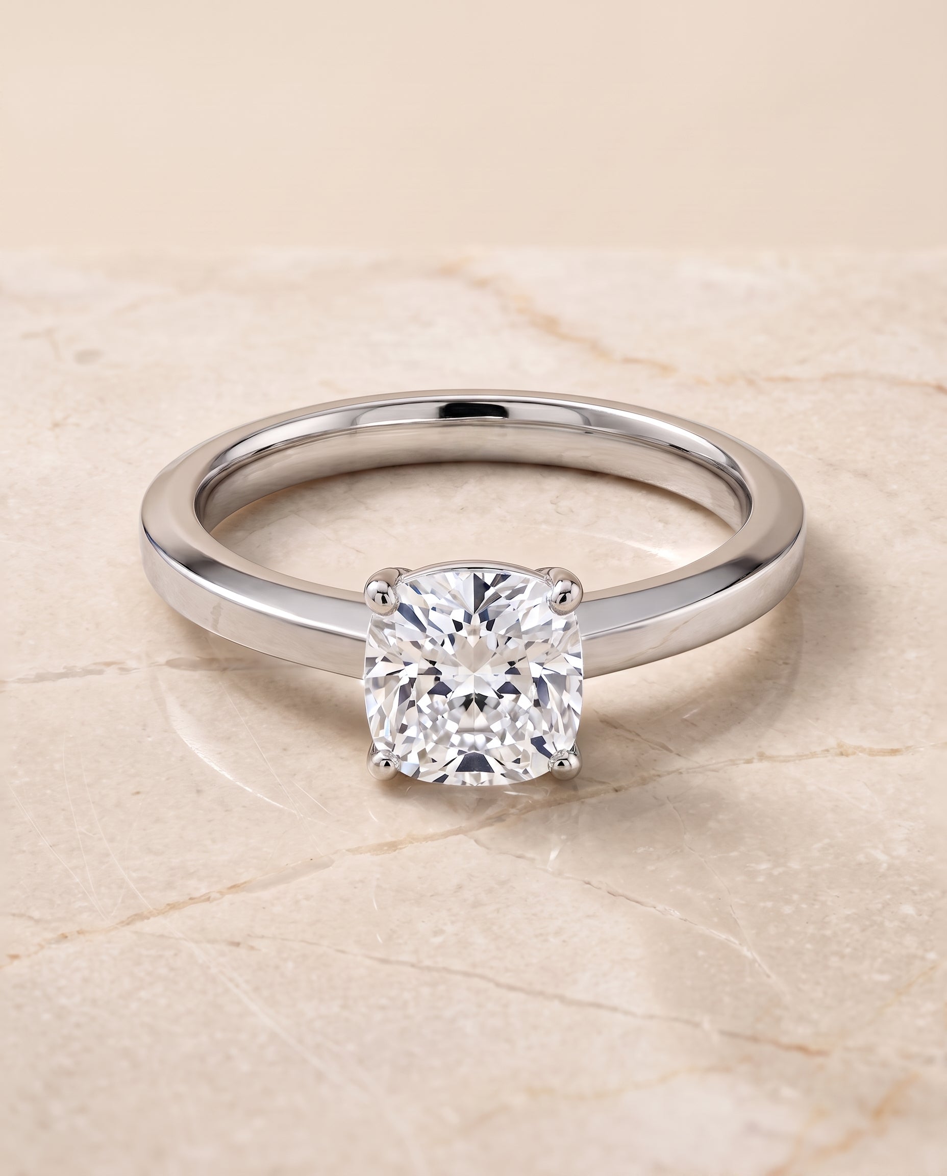 The Carmen Beveled Edge Comfort Fit Solitaire Cushion Cut Engagement Ring Setting in Platinum