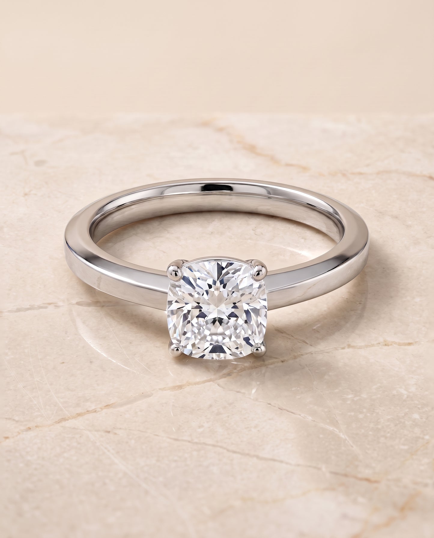 The Carmen Beveled Edge Comfort Fit Solitaire Cushion Cut Engagement Ring Setting in Platinum
