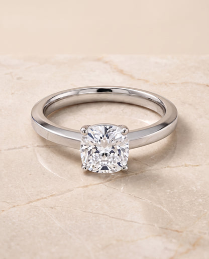 The Carmen Beveled Edge Comfort Fit Solitaire Cushion Cut Engagement Ring Setting in Platinum
