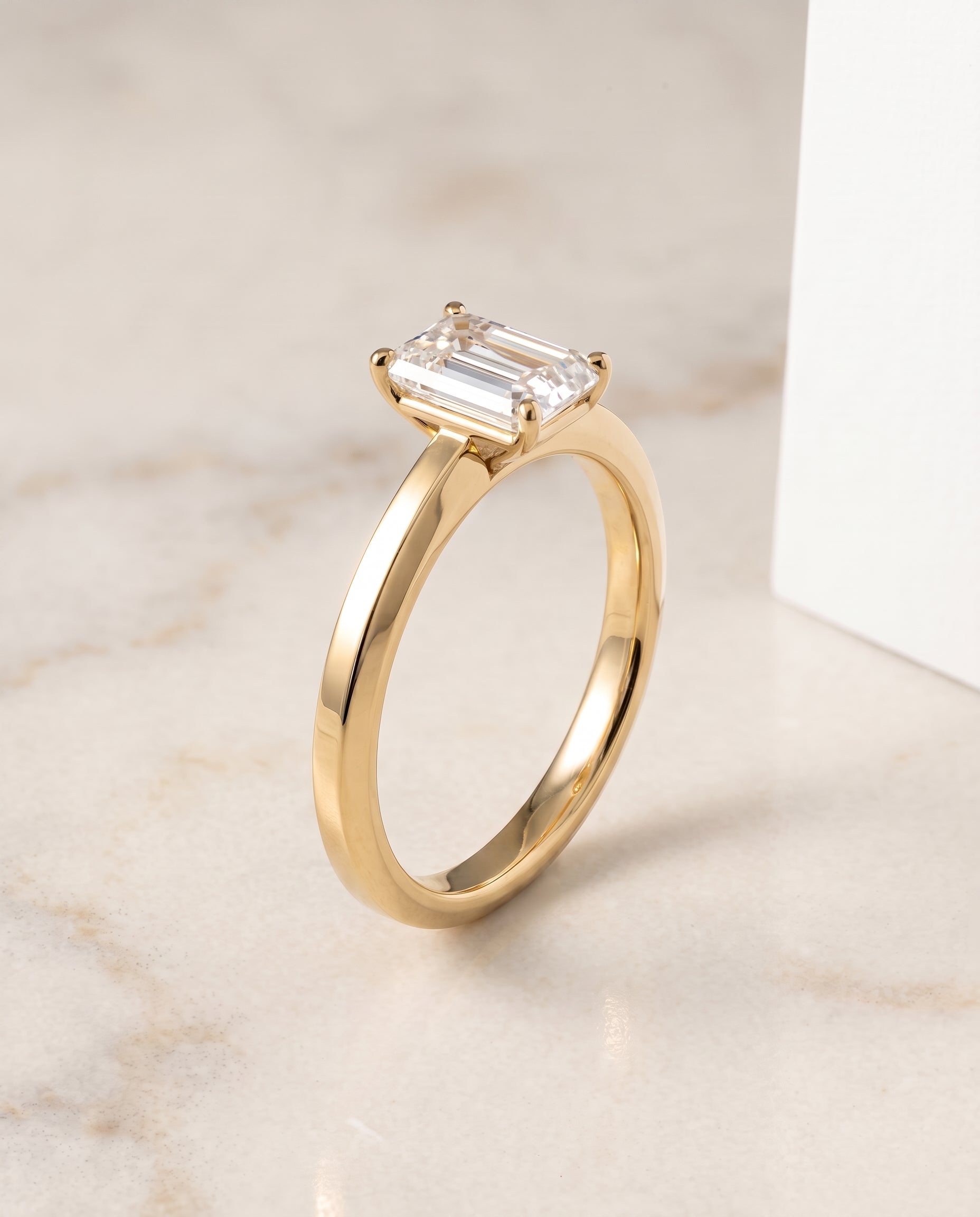 Beveled Edge Comfort Fit Solitaire Cut styling on The Carmen emerald engagement ring setting | RockHer