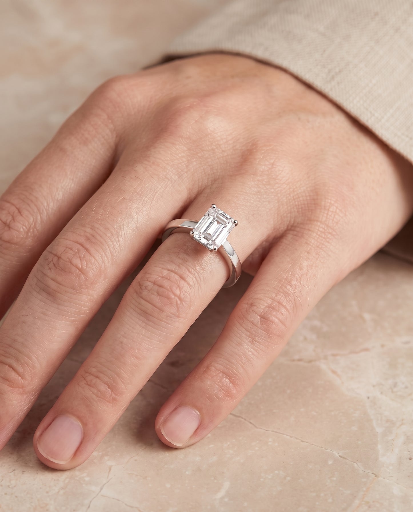 The Carmen Beveled Edge Comfort Fit Solitaire Emerald Cut Engagement Ring Setting in 18K White Gold