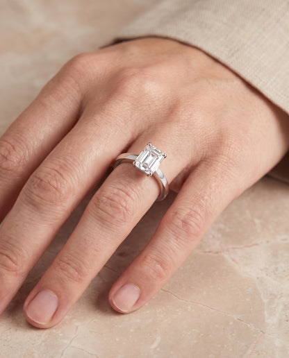 The Carmen Beveled Edge Comfort Fit Solitaire Emerald Cut Engagement Ring Setting in 18K White Gold