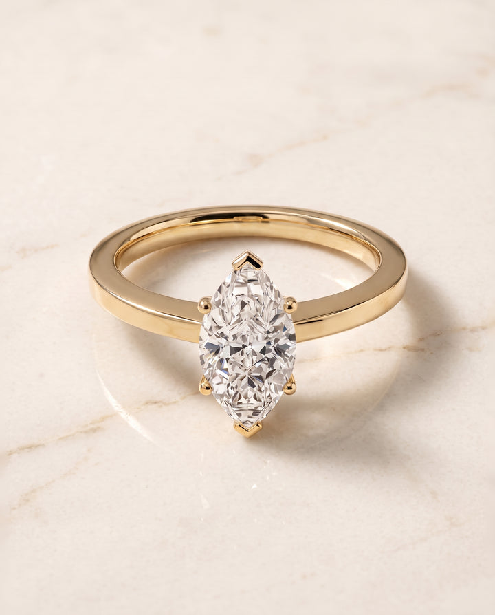 The Carmen Beveled Edge Comfort Fit Solitaire Marquise Engagement Ring Setting in 18K Yellow Gold