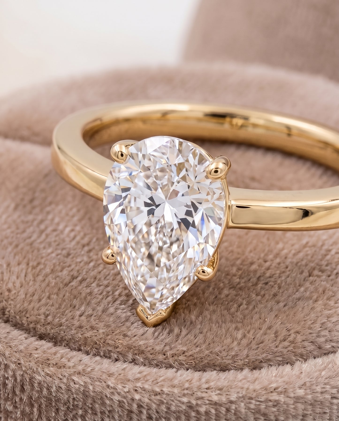 The Carmen Beveled Edge Comfort Fit Solitaire Pear Engagement Ring Setting in 18K Yellow Gold