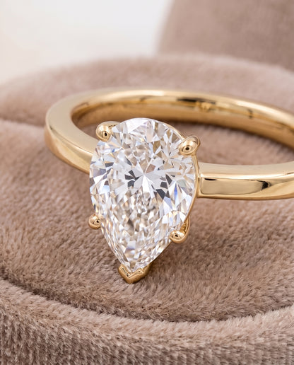 The Carmen Beveled Edge Comfort Fit Solitaire Pear Engagement Ring Setting in 18K Yellow Gold