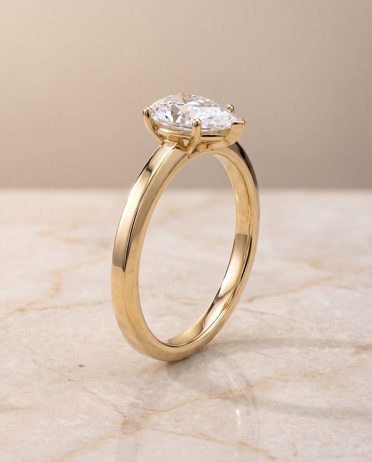The Carmen Beveled Edge Comfort Fit Solitaire Pear Engagement Ring Setting in 18K Yellow Gold