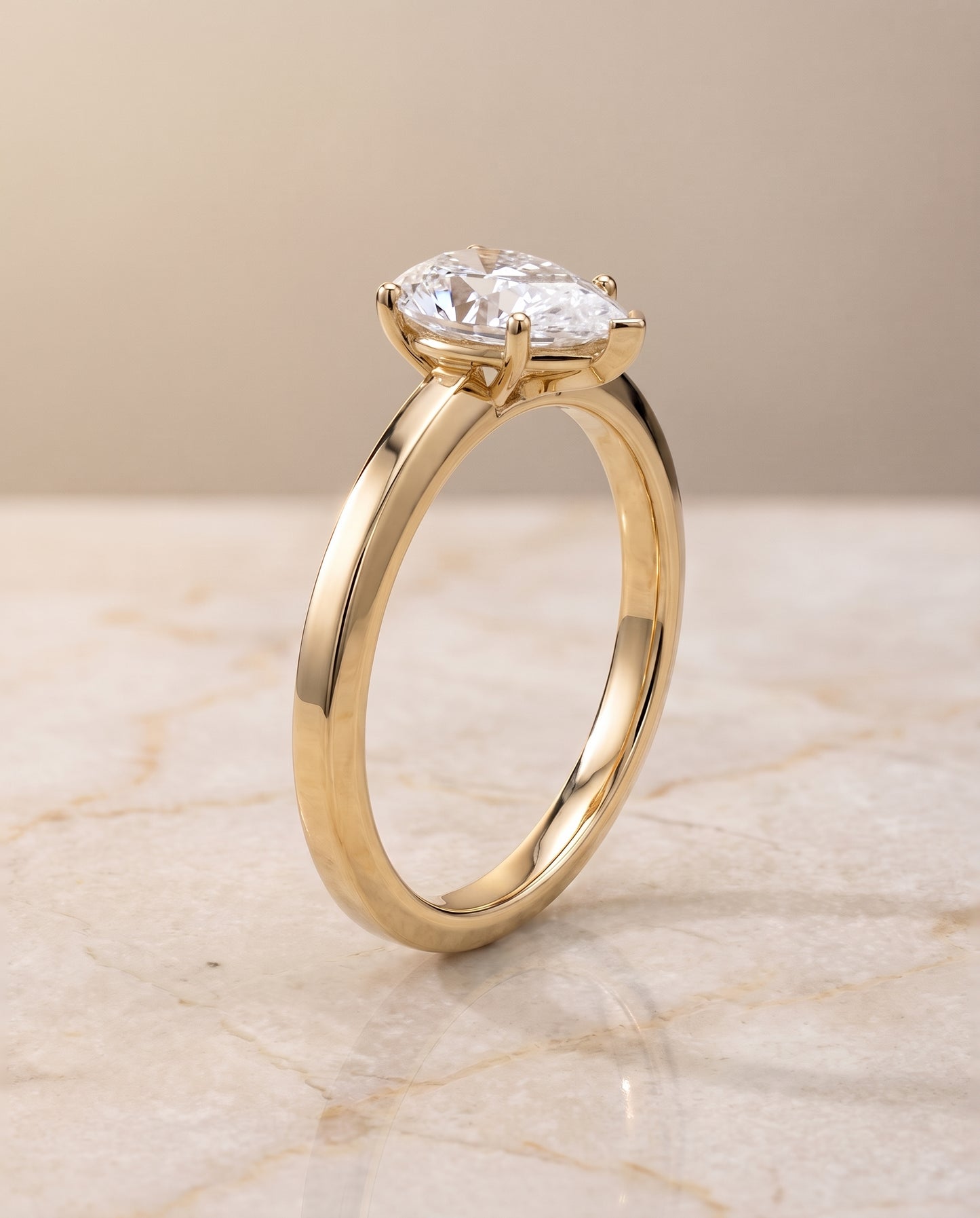 The Carmen Beveled Edge Comfort Fit Solitaire Pear Engagement Ring Setting in 18K Yellow Gold