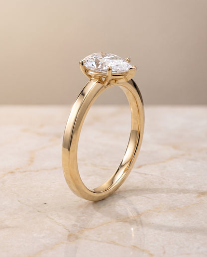 The Carmen Beveled Edge Comfort Fit Solitaire Pear Engagement Ring Setting in 18K Yellow Gold
