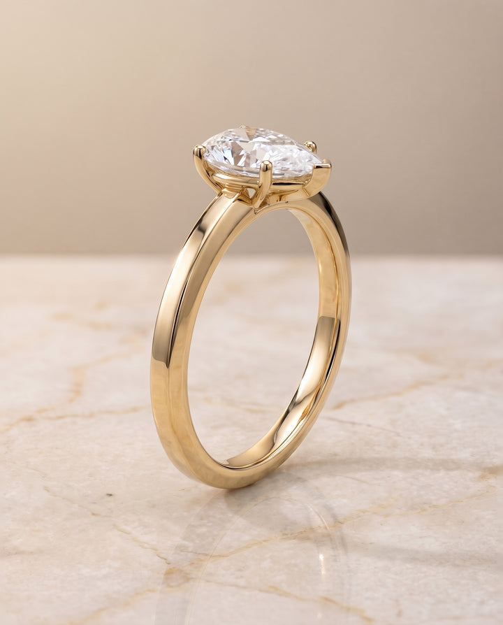The Carmen Beveled Edge Comfort Fit Solitaire Pear Engagement Ring Setting in 18K Yellow Gold