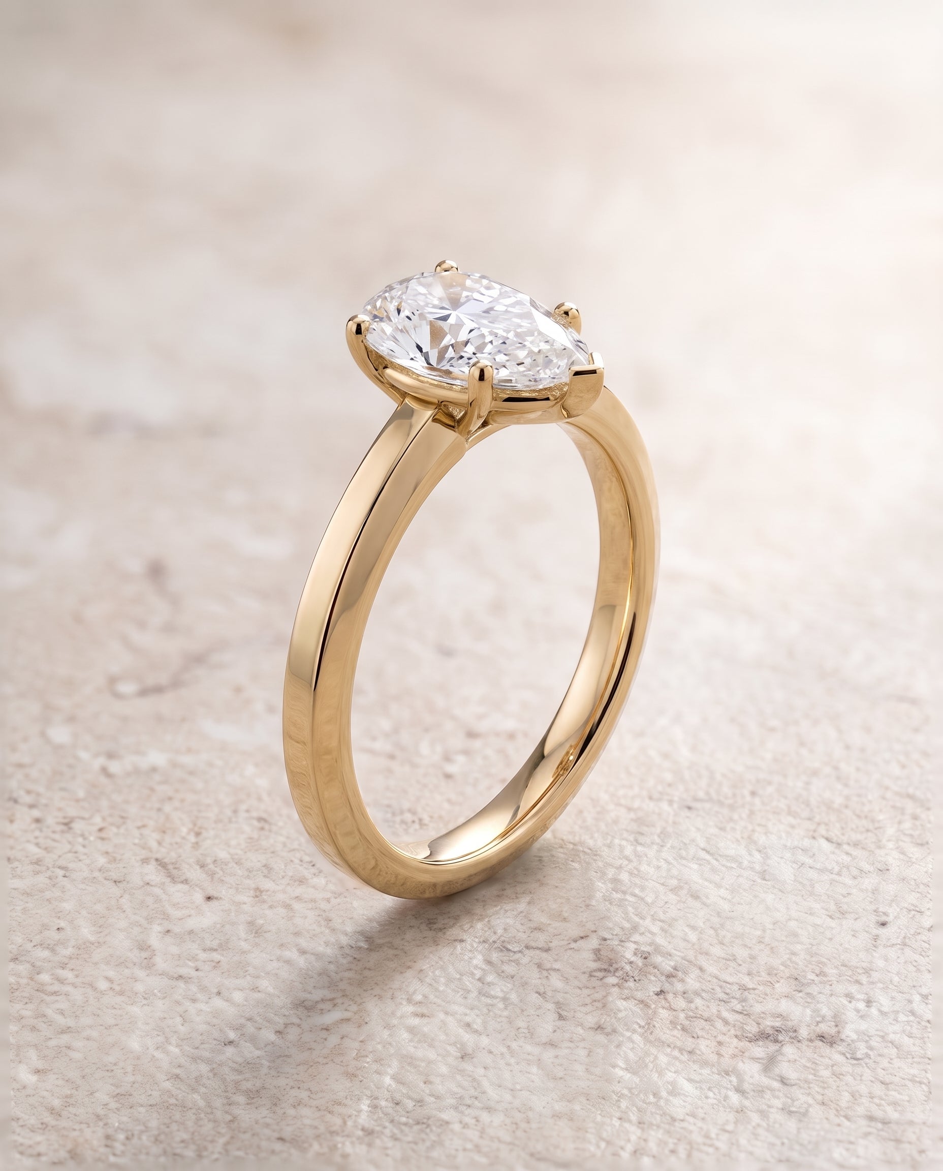 The Carmen Beveled Edge Comfort Fit Solitaire Pear Engagement Ring Setting in 18K Yellow Gold