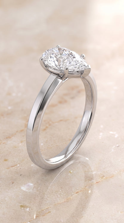 The Carmen Beveled Edge Comfort Fit Solitaire Pear Engagement Ring Setting in 18K White Gold