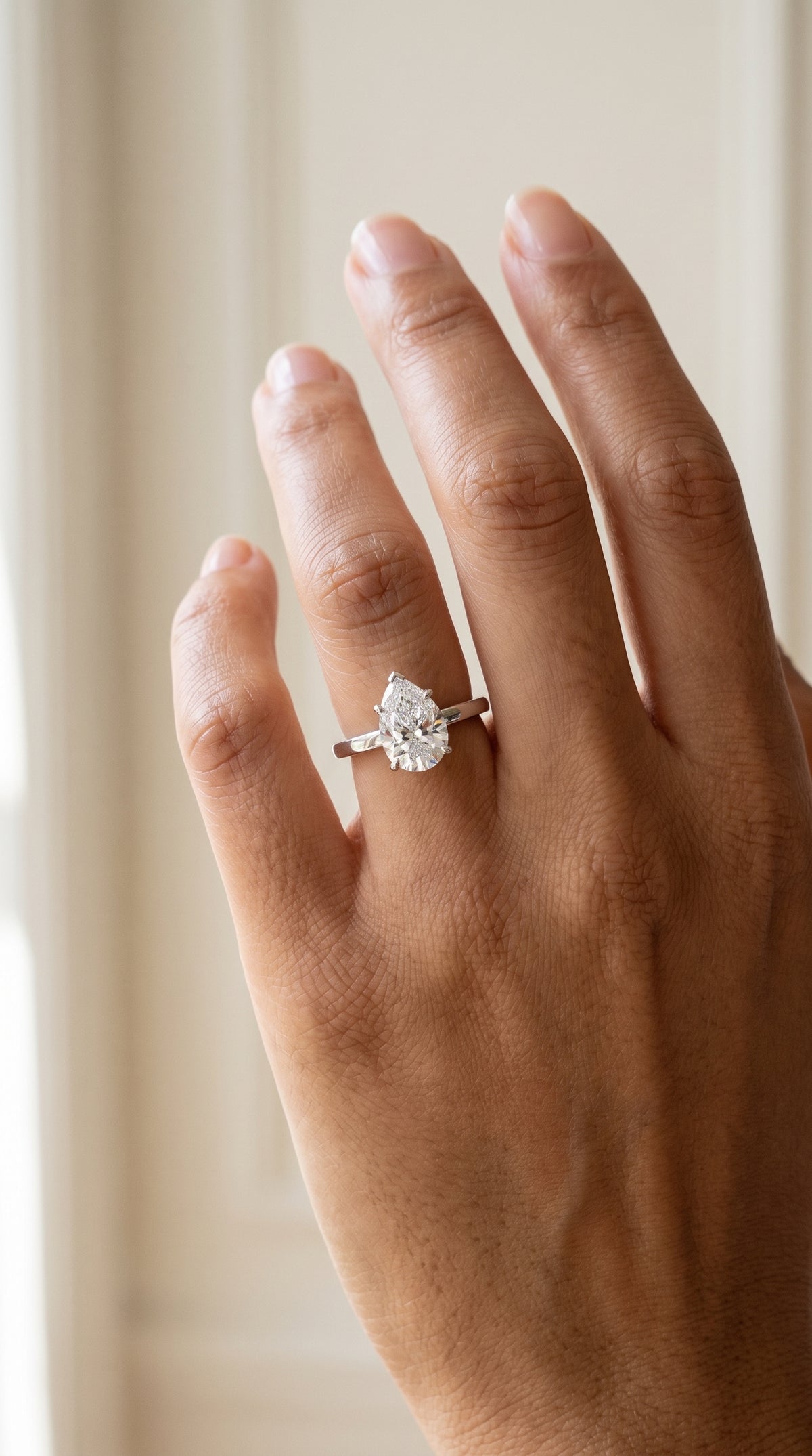 The Carmen Beveled Edge Comfort Fit Solitaire Pear Engagement Ring Setting in 18K White Gold