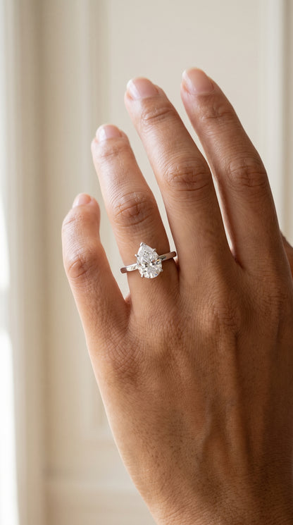 The Carmen Beveled Edge Comfort Fit Solitaire Pear Engagement Ring Setting in 18K White Gold