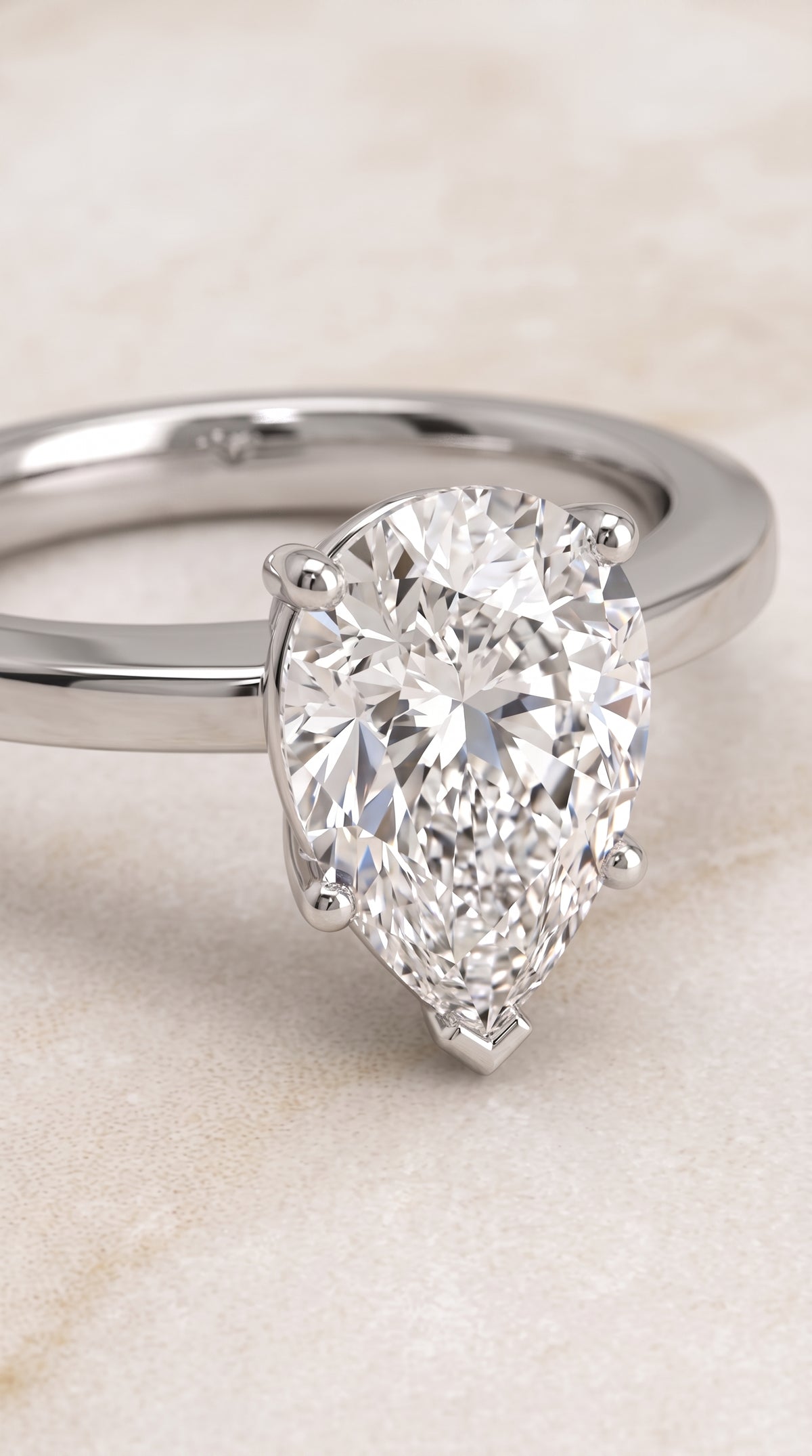 The Carmen Beveled Edge Comfort Fit Solitaire Pear Engagement Ring Setting in 18K White Gold
