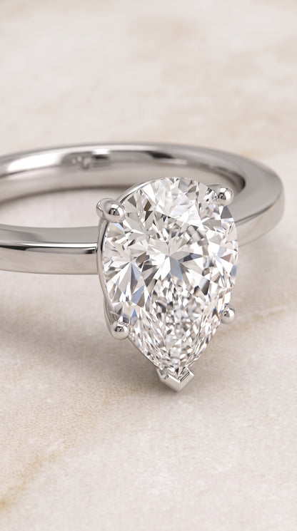 The Carmen Beveled Edge Comfort Fit Solitaire Pear Engagement Ring Setting in 18K White Gold