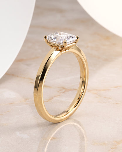 The Carmen Beveled Edge Comfort Fit Solitaire Radiant Cut Engagement Ring Setting in 18K Yellow Gold