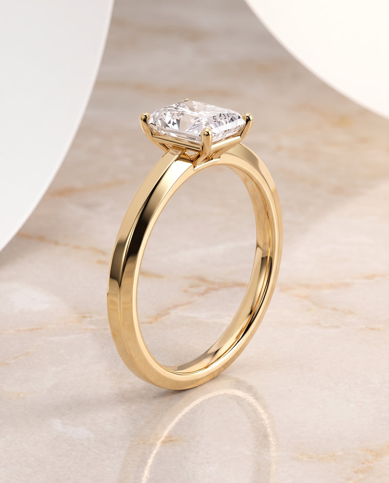 The Carmen Beveled Edge Comfort Fit Solitaire Radiant Cut Engagement Ring Setting in 18K Yellow Gold