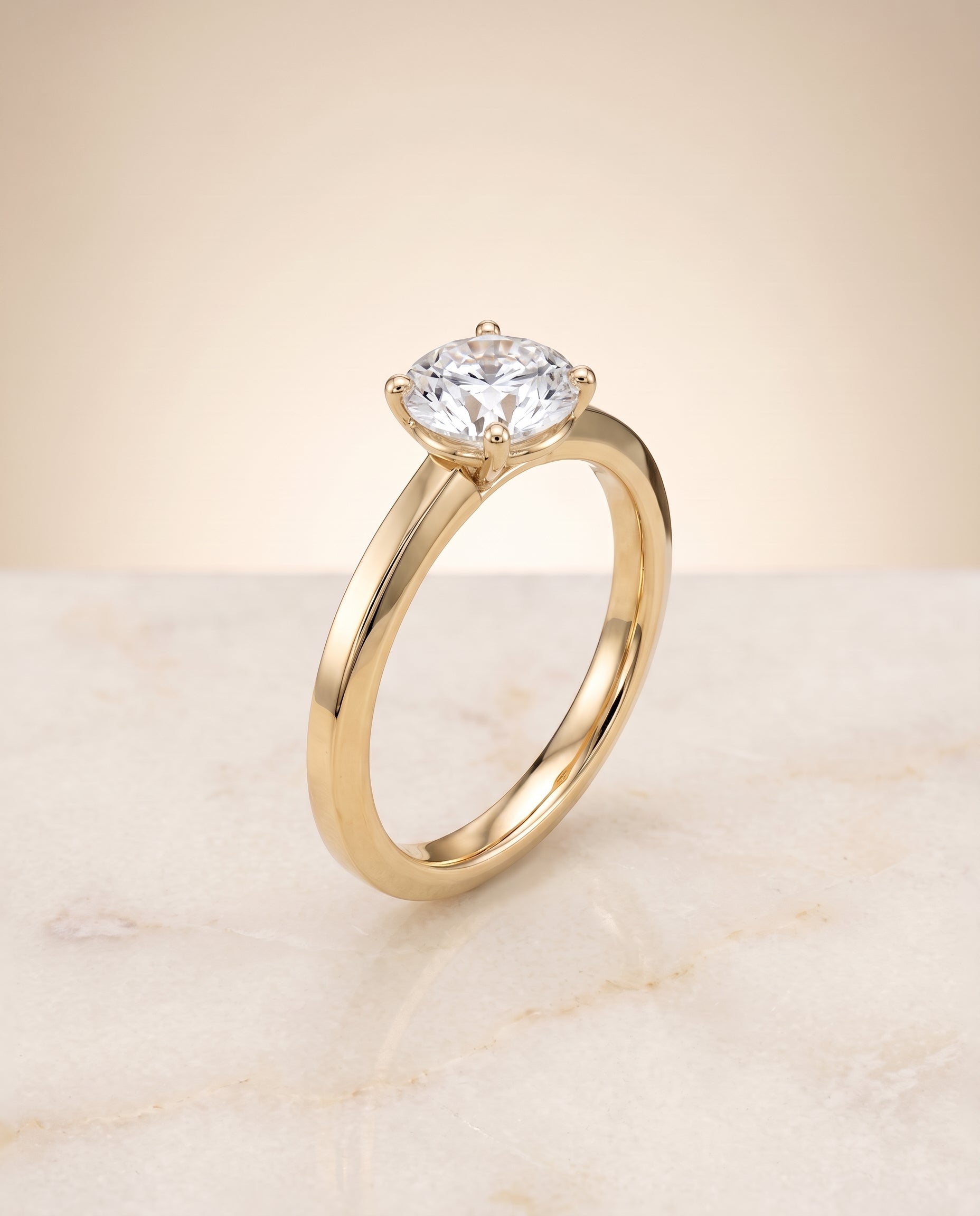 Beveled Edge Comfort Fit Solitaire styling on The Carmen round engagement ring setting | RockHer