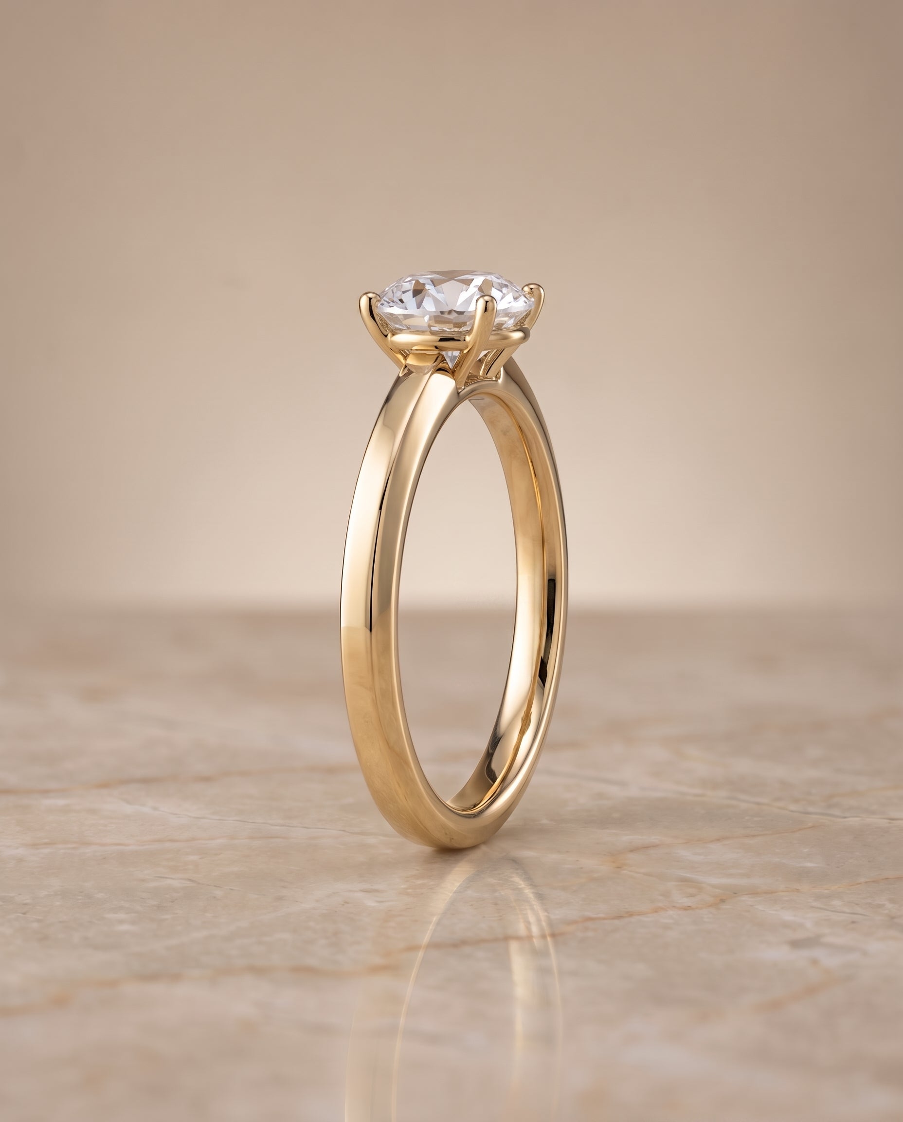 The Carmen setting for round diamonds, made to order in 18K Yellow Gold | RockHer