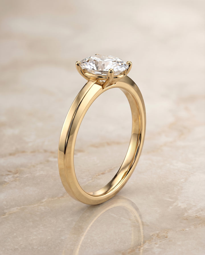 The Carmen Solitaire Engagement Ring Setting for Oval Diamonds in 18K Yellow Gold