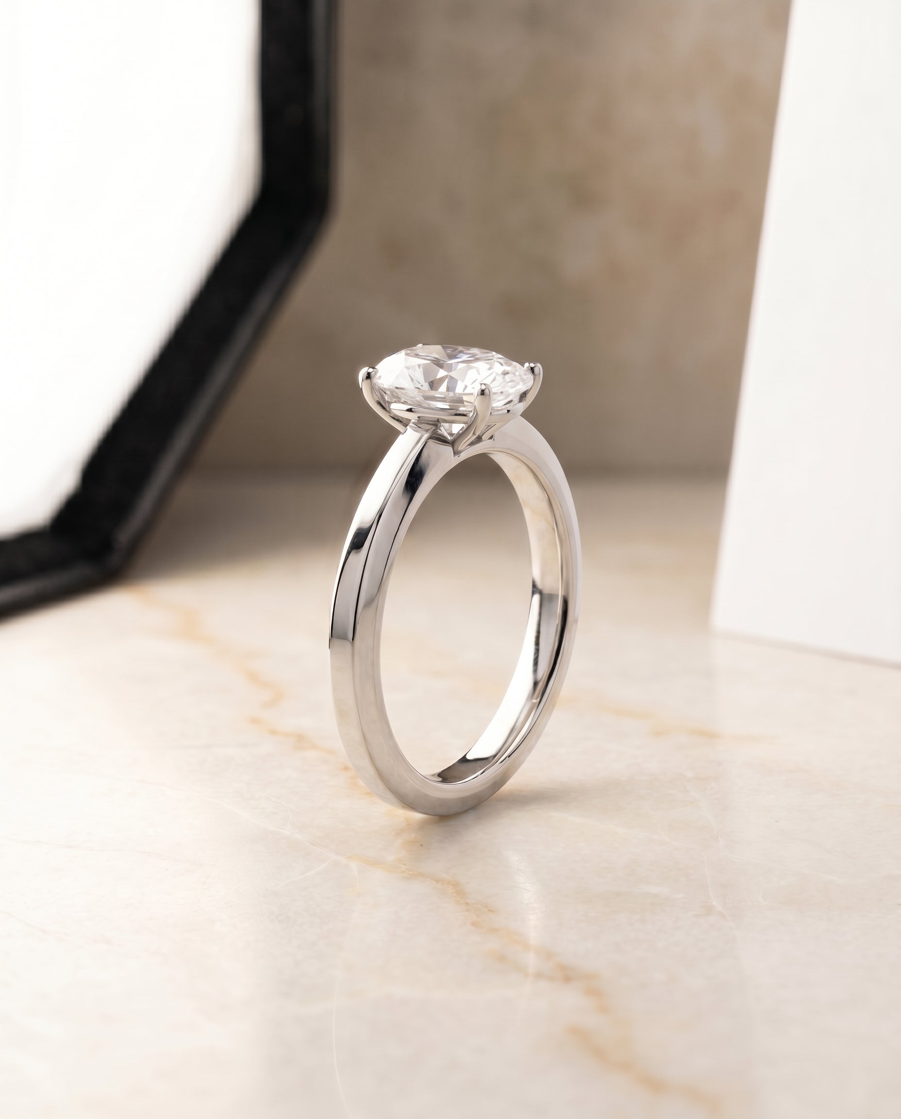 Beveled Edge Comfort Fit Solitaire styling on The Carmen oval engagement ring setting | RockHer