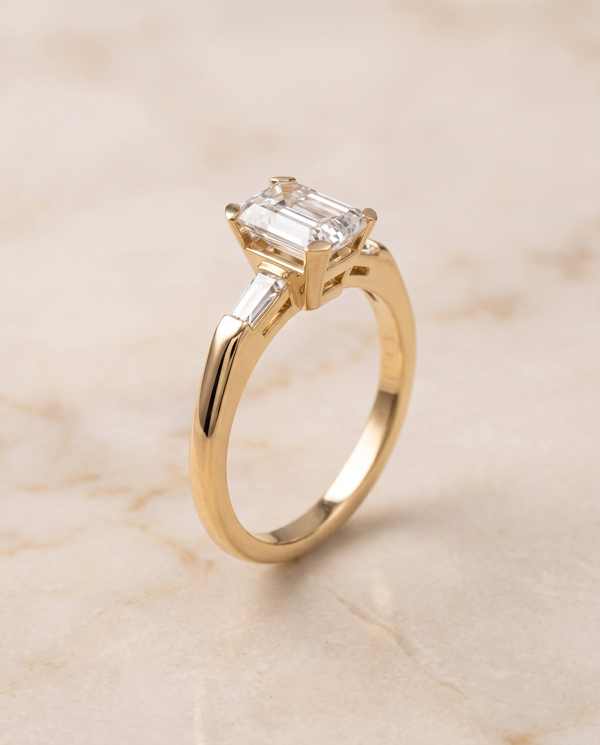 The Caroline Three Stone Emerald Cut Engagement Ring Setting in 18K Yellow Gold