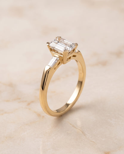 The Caroline Three Stone Emerald Cut Engagement Ring Setting in 18K Yellow Gold