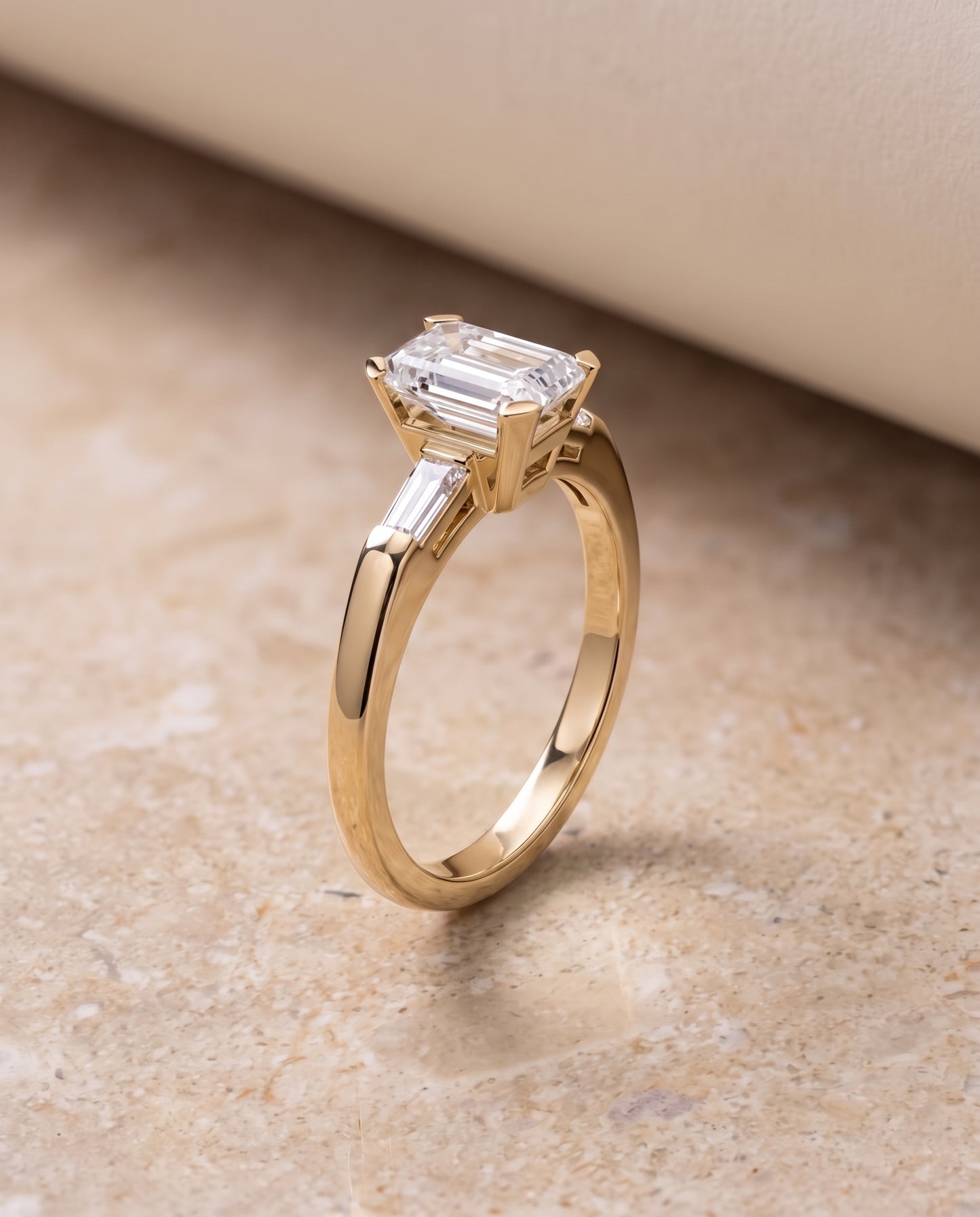 The Caroline Three Stone Emerald Cut Engagement Ring Setting in 18K Yellow Gold