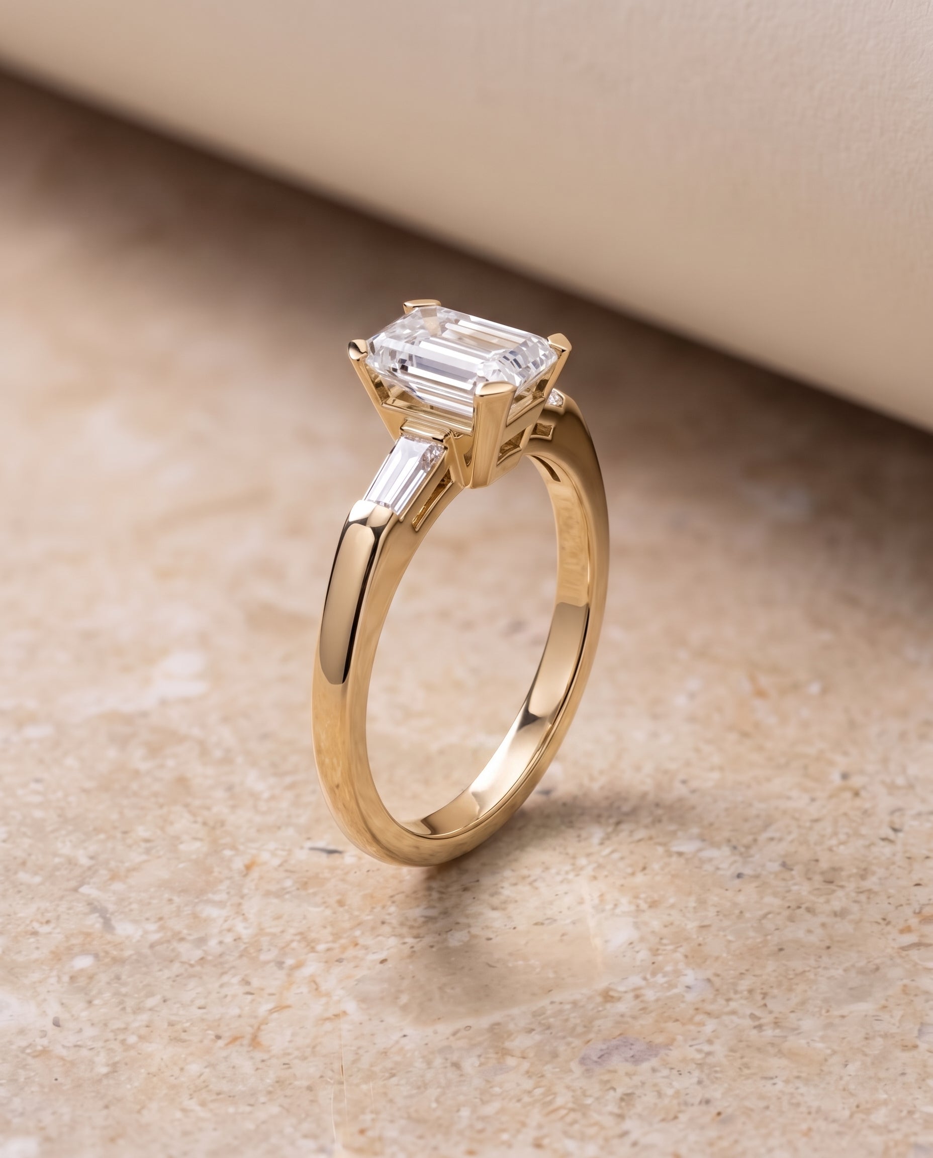 The Caroline Three Stone Emerald Cut Engagement Ring Setting in 18K Yellow Gold