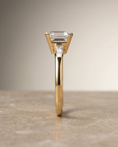 The Caroline Three Stone Emerald Cut Engagement Ring Setting in 18K Yellow Gold