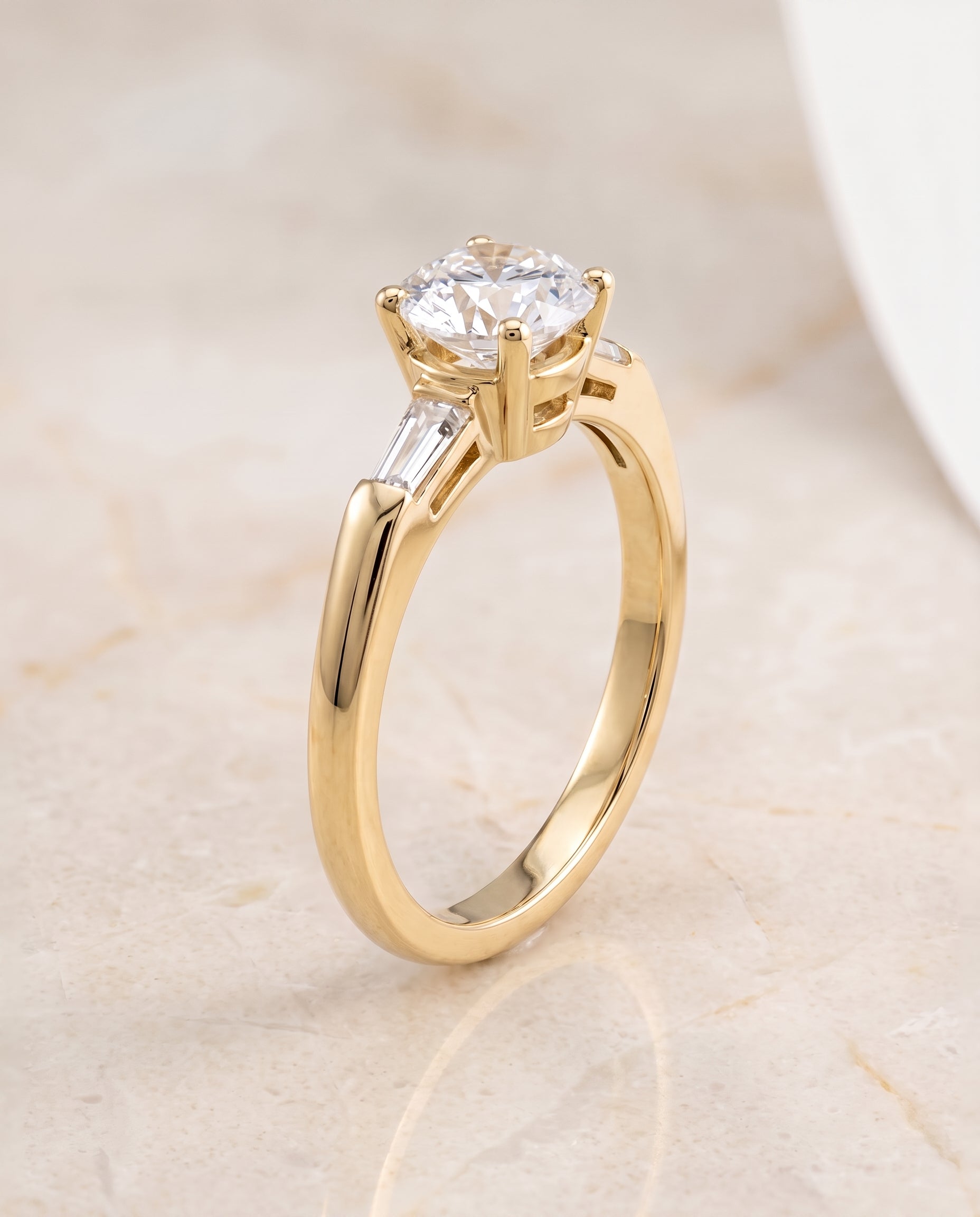 The Caroline Three Stone Round Engagement Ring Setting in 18K Yellow Gold