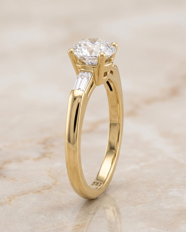 The Caroline Three Stone Round Engagement Ring Setting in 18K Yellow Gold