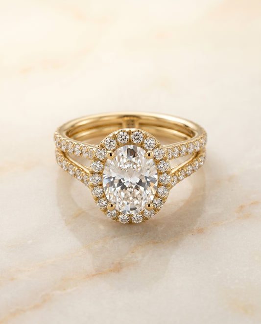 The Celine Halo Engagement Ring Setting for Oval Diamonds in 18K Yellow Gold