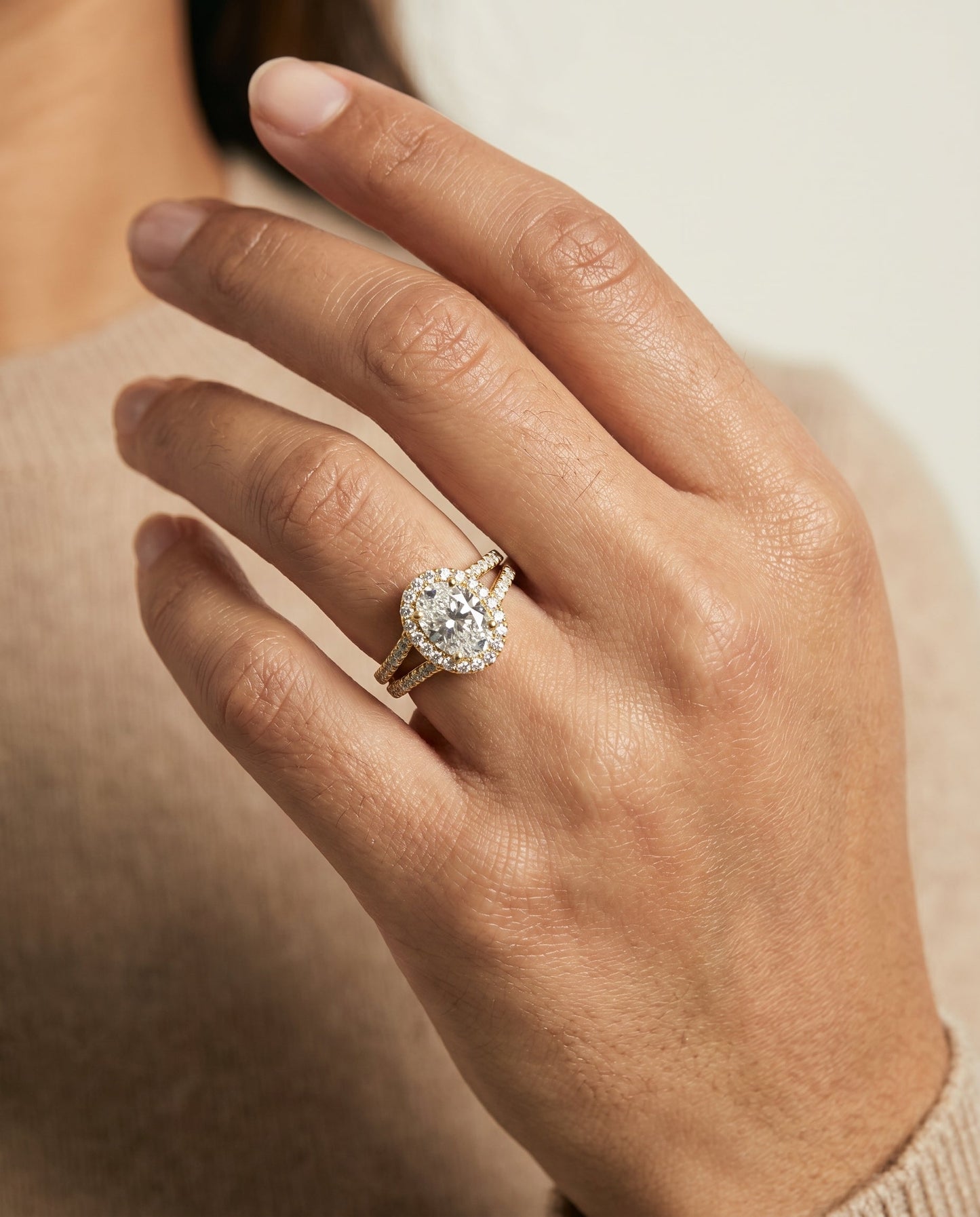 Celine Select Halo Oval Lab Diamond Engagement Ring in 18K Yellow Gold, shown on hand | RockHer
