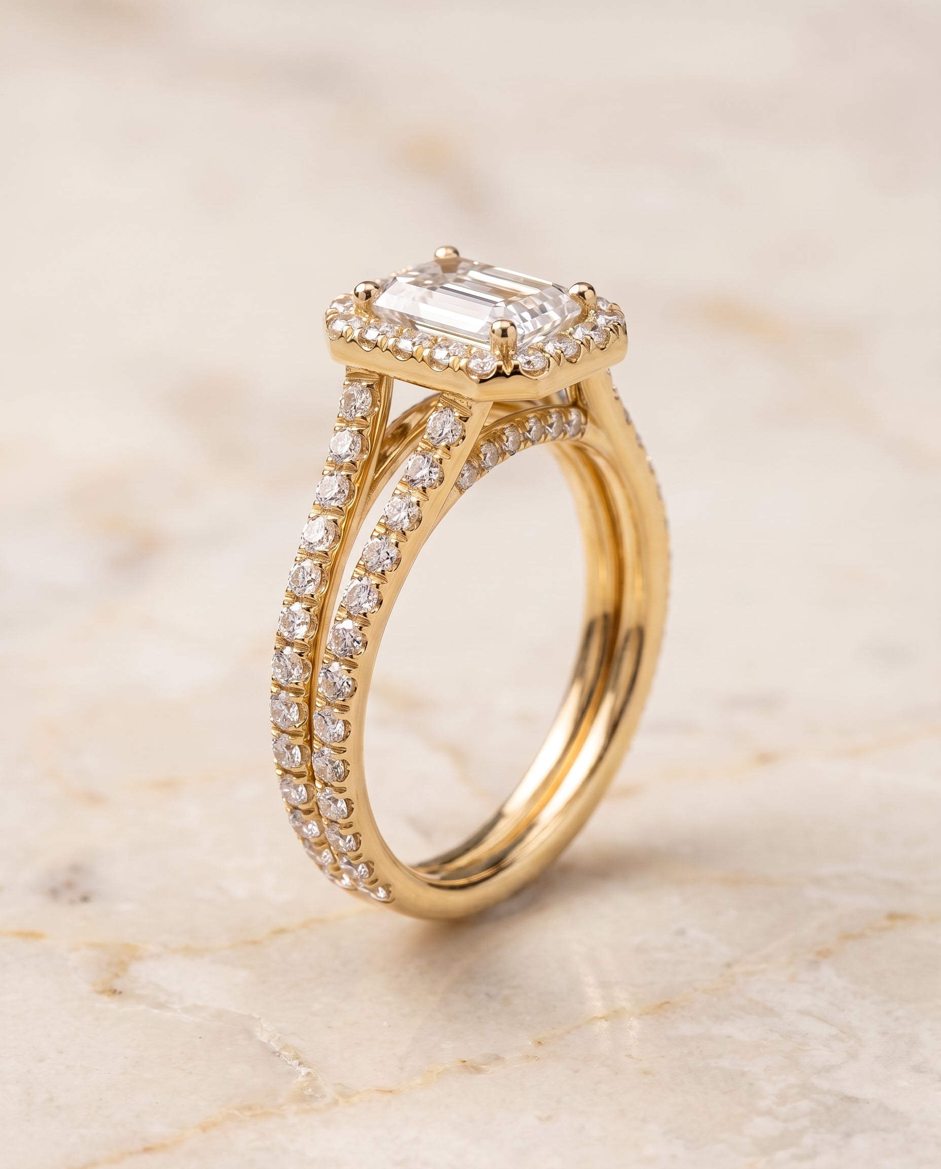 The Celine Two Row Pavé Split Shank Halo Emerald Cut Engagement Ring Setting in 18K Yellow Gold