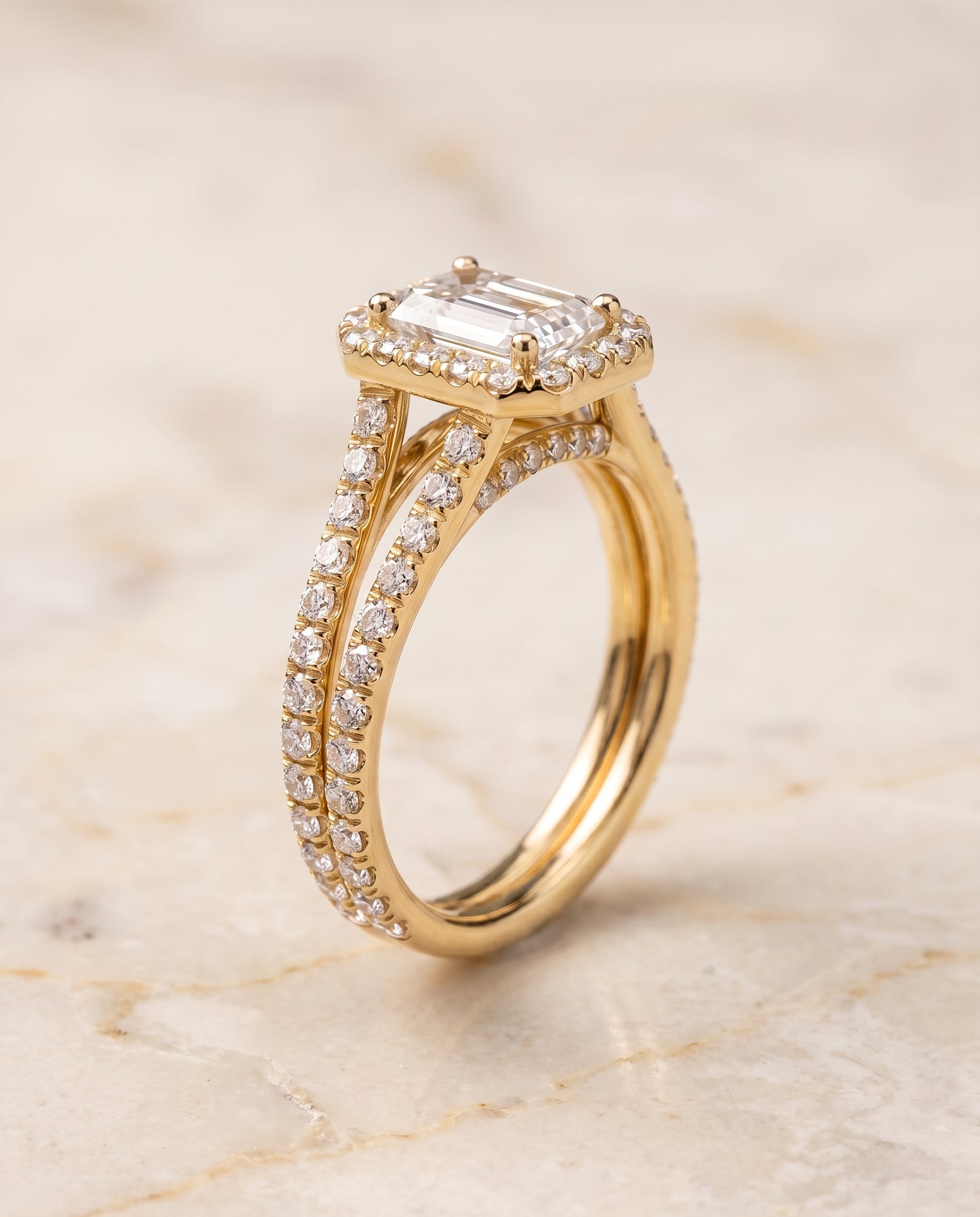 The Celine Two Row Pavé Split Shank Halo Emerald Cut Engagement Ring Setting in 18K Yellow Gold