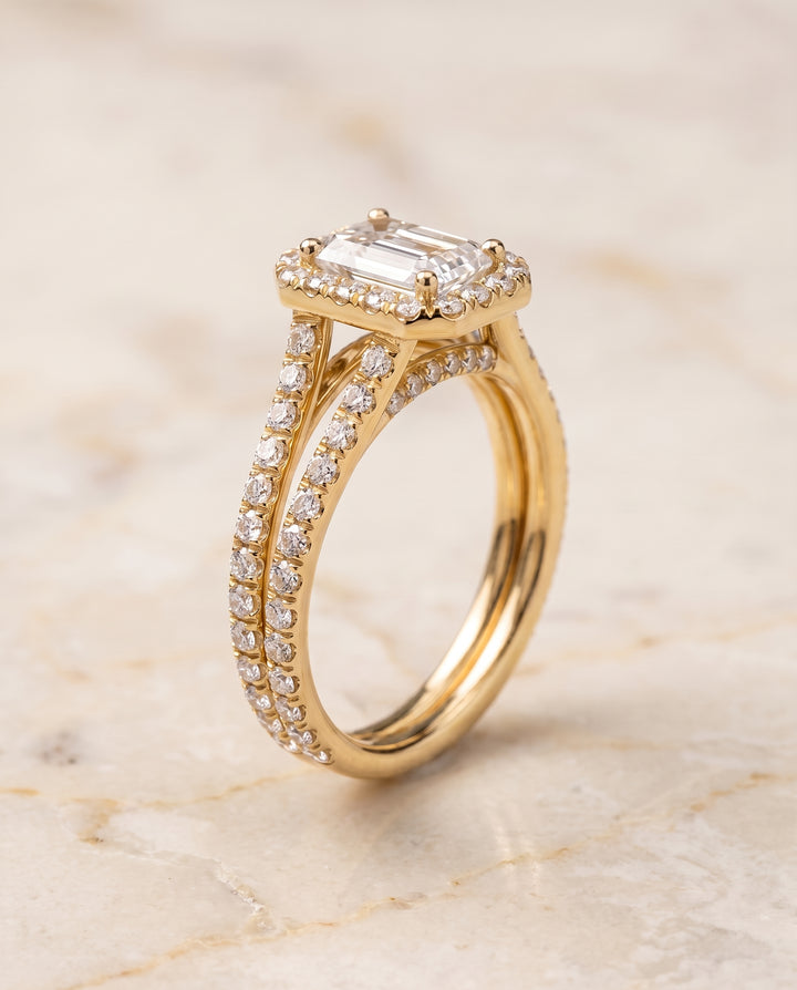 The Celine Two Row Pavé Split Shank Halo Emerald Cut Engagement Ring Setting in 18K Yellow Gold