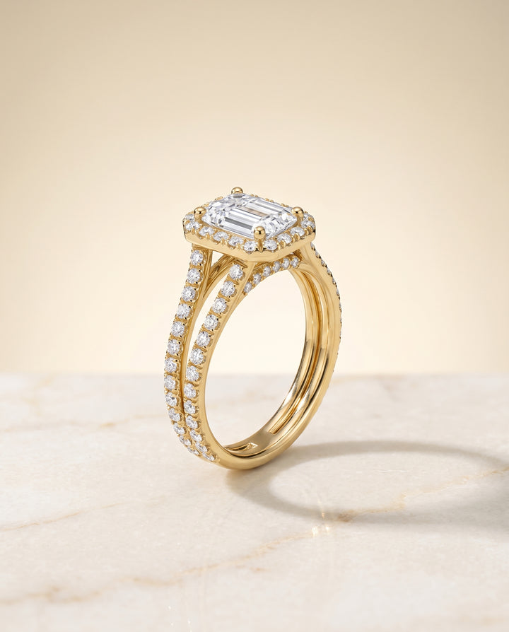 The Celine Two Row Pavé Split Shank Halo Emerald Cut Engagement Ring Setting in 18K Yellow Gold
