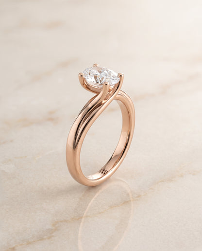The Joplin Twisted Bypass Solitaire Oval Engagement Ring Setting in 14K Rose Gold
