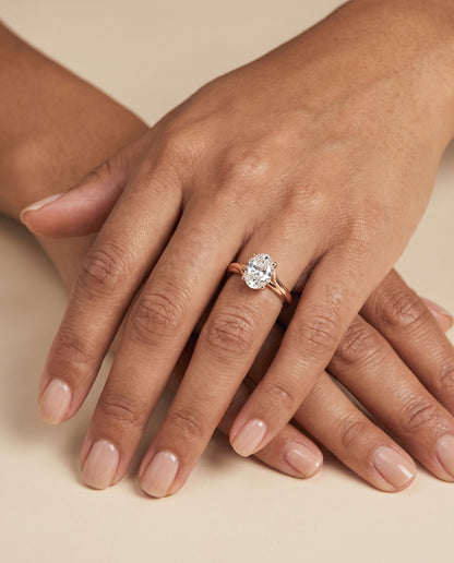 The Joplin Twisted Bypass Solitaire Oval Engagement Ring Setting in 14K Rose Gold
