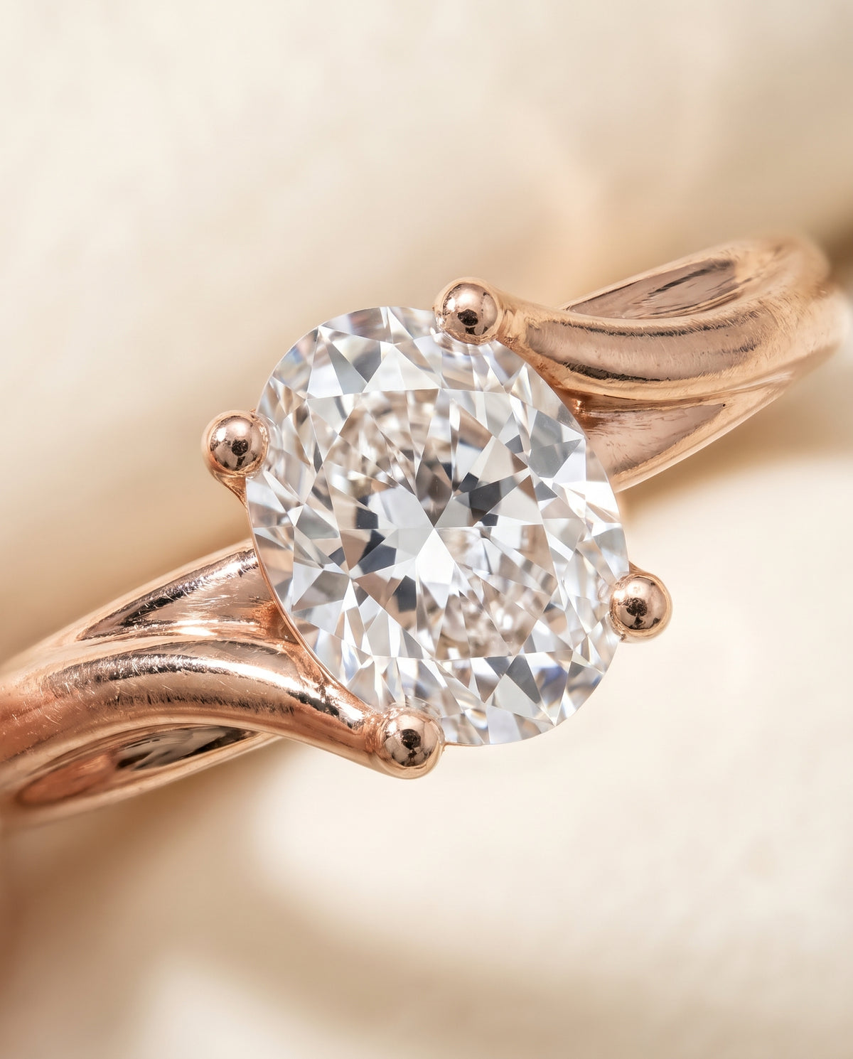 The Joplin Twisted Bypass Solitaire Oval Engagement Ring Setting in 14K Rose Gold