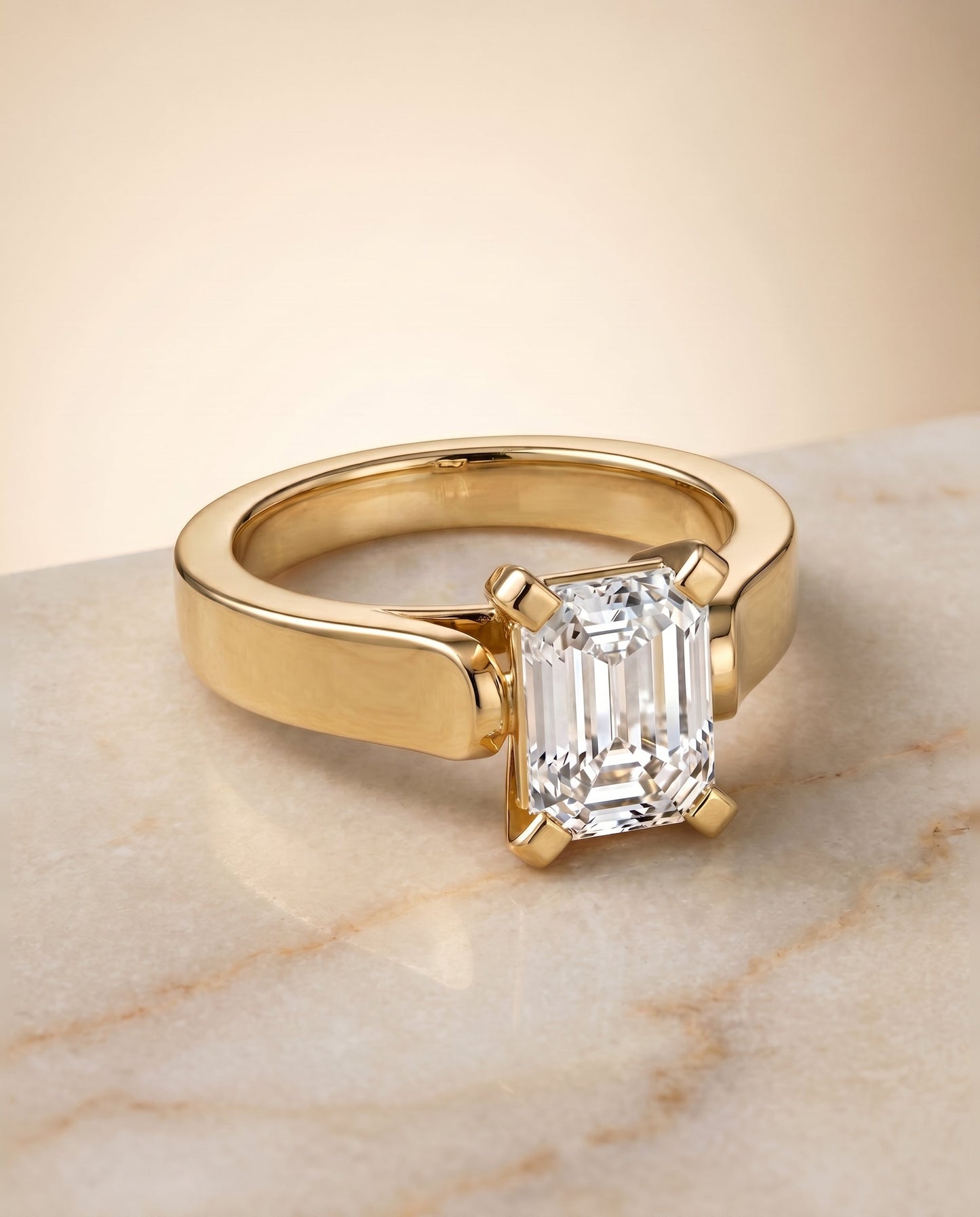 Charlotte Select Cathedral Solitaire Emerald Cut Lab Diamond Engagement Ring in 18K Yellow Gold, shown on hand, angled | RockHer