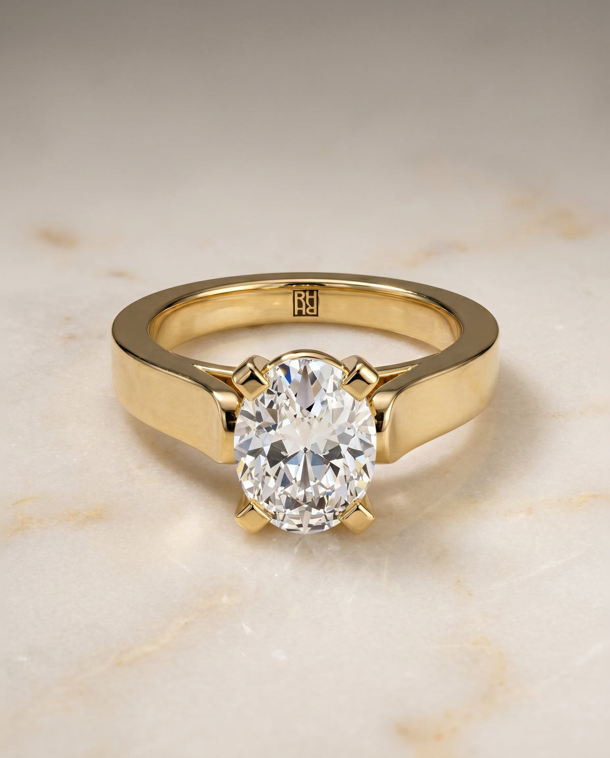 Charlotte Select Cathedral Solitaire Oval Lab Diamond Engagement Ring in 18K Yellow Gold, shown on hand, angled | RockHer