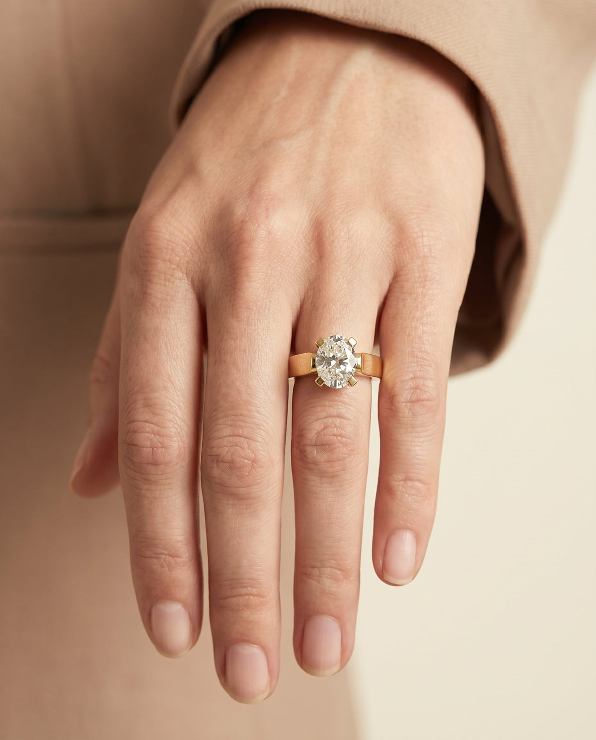 Charlotte Select Cathedral Solitaire Oval Lab Diamond Engagement Ring in 18K Yellow Gold, shown on hand | RockHer